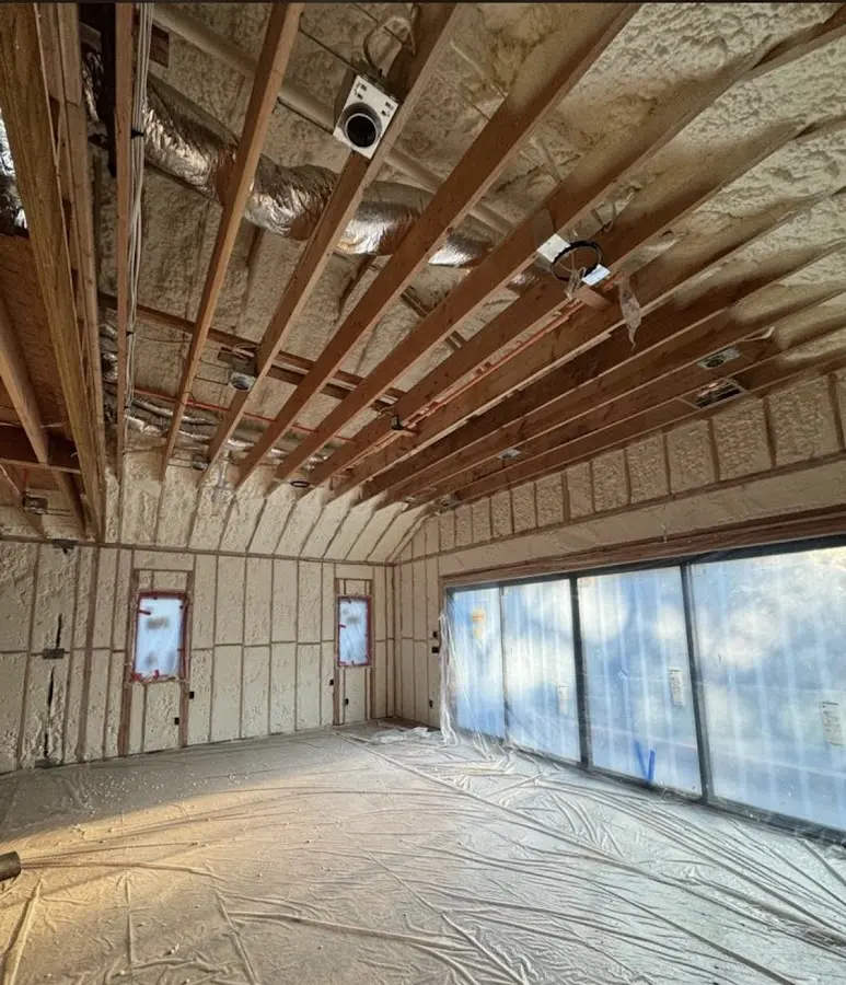 Interior walls and ceiling insulated with spray foam during new construction in La Plata